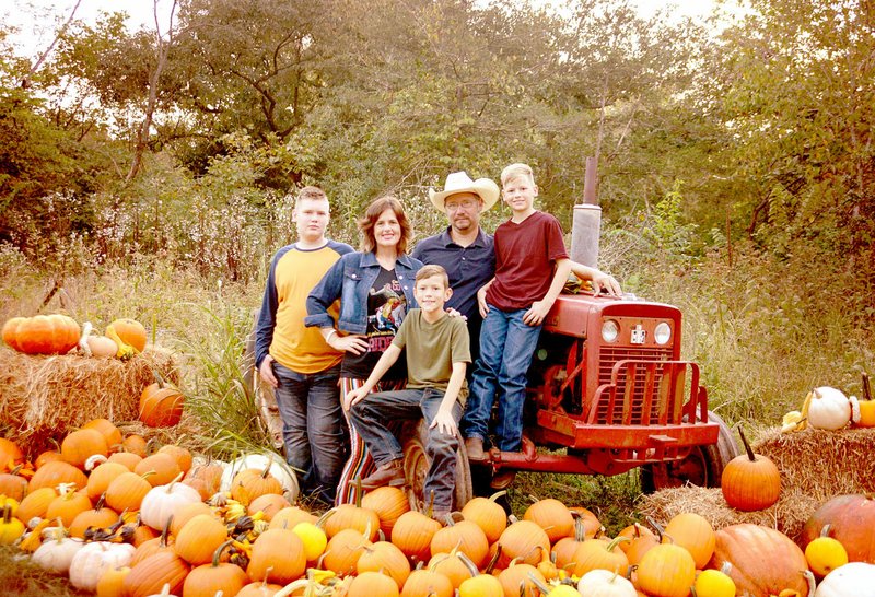PHOTO SUBMITTED The Thurlo family, Harlon (left), Jen, Quinten, Jason and Owen, supply produce to local farmers markets and offer a vegetable subscription from their farm, which is partially located in McDonald County.