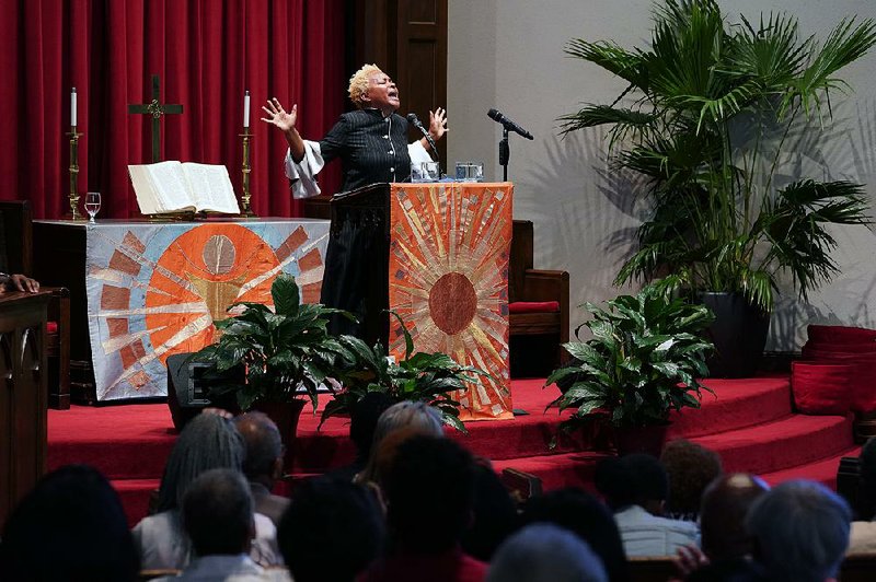 Rev. LaKeesha Walrond, who recently became president of New York Theo- logical Seminary, gives a sermon at Grace Baptist Church in Mt. Vernon, N.Y. Walrond, the first black woman to take charge of the seminary, wants to revitalize the institution by connecting with the community. 