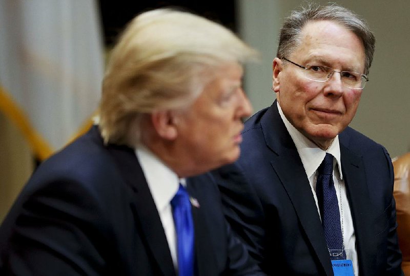 National Rifle Association chief Wayne LaPierre, shown at a February 2017 White House event with President Donald Trump, said in a statement Thursday that the NRA opposes any legislation that “unfairly infringes upon the rights of law-abiding citizens” and that proposals before Congress would not have prevented the mass shootings in Texas and Ohio. 