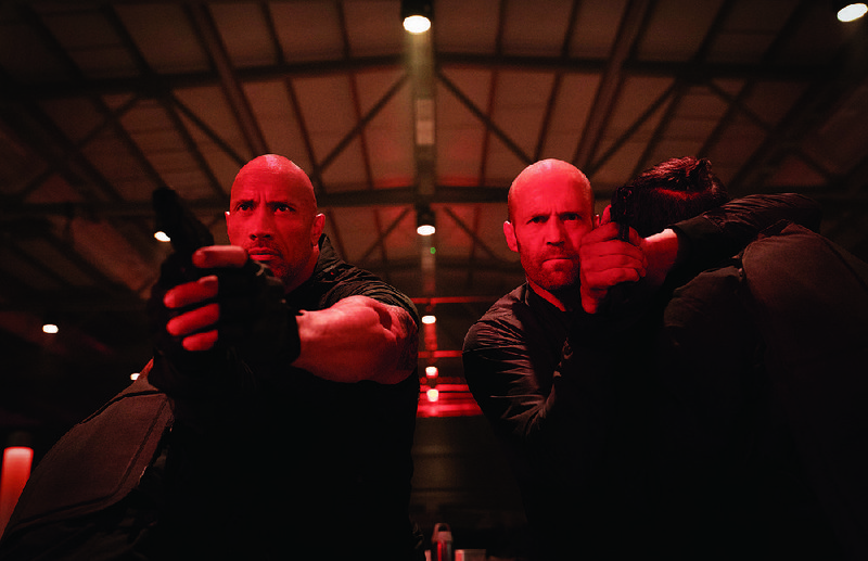 Dwayne Johnson (left) and Jason Statham star as an American operative and an English gun-for-hire in Universal’s action spinoff Fast & Furious Presents: Hobbs & Shaw. It came out on top at last weekend’s box office and made about $60.8 million. 