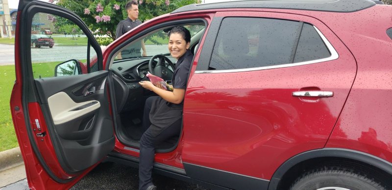 Maria Elena Barragan sitting in the vehicle that was gifted to her from the customers 