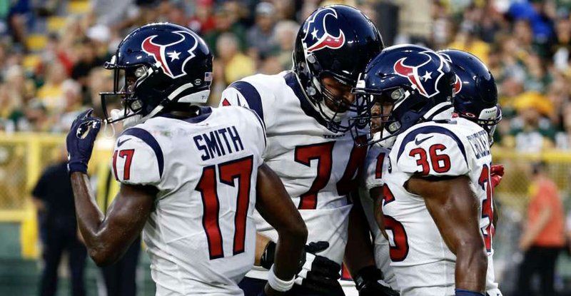 Houston Texans running back Damarea Crockett (36) celebrates his touchdown run with teammates Byncint Smith (17) and Max Scharping (74) during an NFL preseason football game against the Green Bay Packers at Lambeau Field on Thursday, Aug. 8, 2019, in Green Bay, Wis. Photo: Brett Coomer/Staff Photographer
