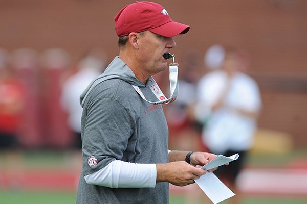 Arkansas coach Chad Morris directs his players Friday, Aug. 2, 2019, during practice at the university practice field in Fayetteville. 