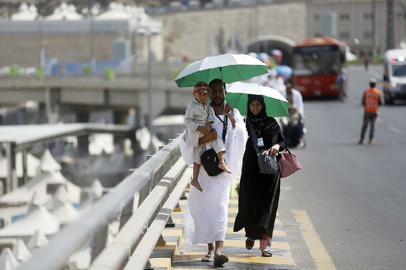 Yemeni pilgrims take part in a ritual walk at Mina in Saudi Arabia as part of the annual hajj, which draws hundreds of thousands of the faithful. 