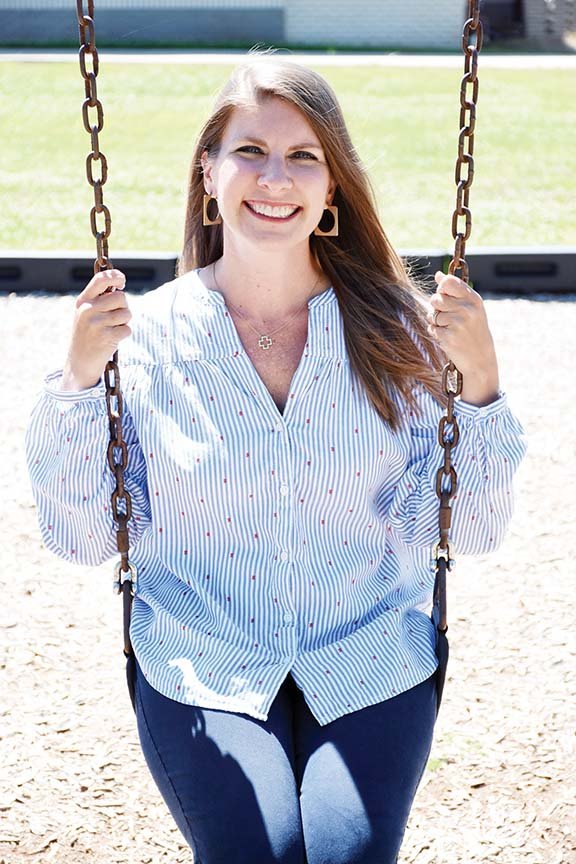 Melissa Spence sits in a swing on the Theodore Jones Elementary School playground in Conway, where she teaches first grade. Spence, the Conway School District Teacher of the Year, was named one of four state semifinalists for 2020 Arkansas Teacher of the Year. She said the announcement was “surreal” and “mind-blowing.”