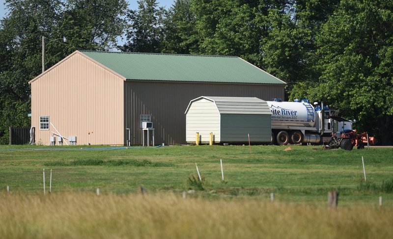 NWA Democrat-Gazette/DAVID GOTTSCHALK The Bethel Heights Lincoln Street Waste Water Treatment Plant is visible Thursday, June 13, 2019, from the Lawrence Bowen property in Bethel Heights. The Arkansas Department of Environmental Quality is ordering Bethel Heights to pump and truck off waste seven day a week.