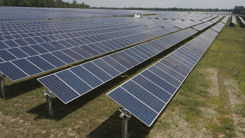 FILE - This Aug. 6, 2019, file photo shows Dominion Energy's Scott Solar farm in Powhatan, Va. (AP Photo/Steve Helber, File)