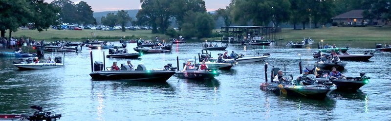 The Sentinel-Record/Richard Rasmussen STARTING LINE: Anglers line up for the take off on the first day of fishing competition at the FLW Cup Friday at Andrew Hulsey Fish Hatchery on Lake Hamilton.