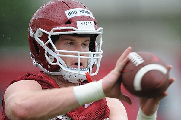 Arkansas tight end Hudson Henry (82) makes a catch Saturday, Aug. 3, 2019, during practice at the university practice field in Fayetteville.