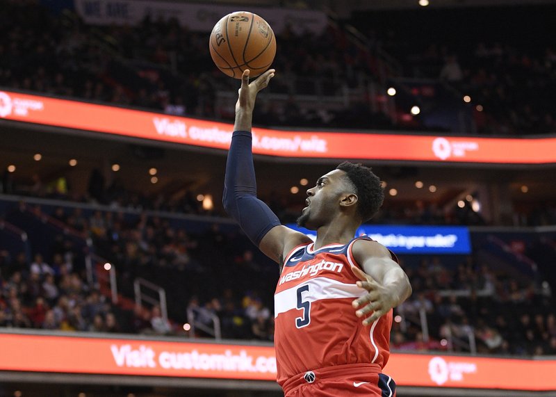 Bobby Portis goes to the basket against Cleveland Cavaliers guard Jordan Clarkson (8) during the first half of an NBA basketball game Friday, Feb. 8, 2019, in Washington. (AP Photo/Nick Wass)