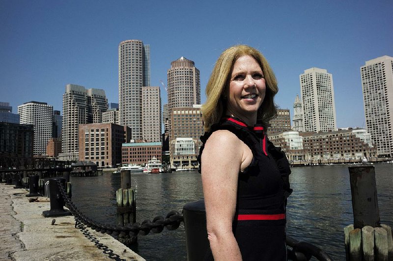 Deborah Sweeney, CEO of MyCorporations.com, poses for a photograph earlier this month in Boston with the Boston skyline visible behind. 