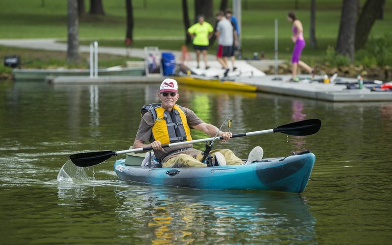 NWA Democrat-Gazette/BEN GOFF &#8226; @NWABENGOFF Gary Dieker, a veteran from Siloam Springs, fishes from a kayak Saturday during the Heroes on the Water event at Lake Fayetteville.