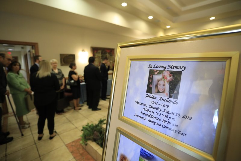 Mourners gather to attend the visitation services for Jordan Anchondo at San Jose Funeral Home in El Paso, Texas on Saturday, Aug. 10, 2019.  Andre and Jordan Anchondo, were among the several people killed last Saturday, when a gunman opened fire inside a Walmart packed with shoppers. Authorities say Jordan Anchondo was shielding the baby, while her husband shielded them both. (AP Photo/Jorge Salgado)