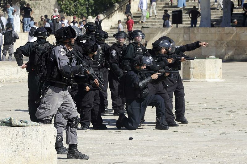 Israeli police gather at the Al-Aqsa Mosque compound in Jerusalem, the site of Sunday’s clashes. 