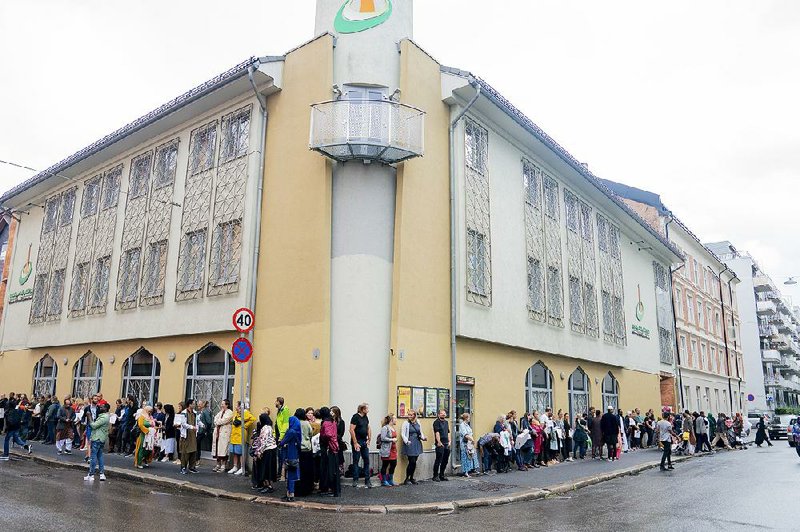 People gather Sunday in a show of support for the Al-Noor Islamic Center in Baerum, Norway. 