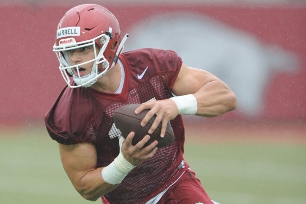 Arkansas tight end Chase Harrell makes a catch Saturday, Aug. 3, 2019, during practice at the university practice field in Fayetteville. 