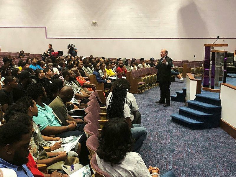 Detroit Mayor Mike Duggan, shown last week at an event where residents registered to apply f or Fiat Chrysler jobs, has said the goal is for people “to own homes and raise families in this city.” 