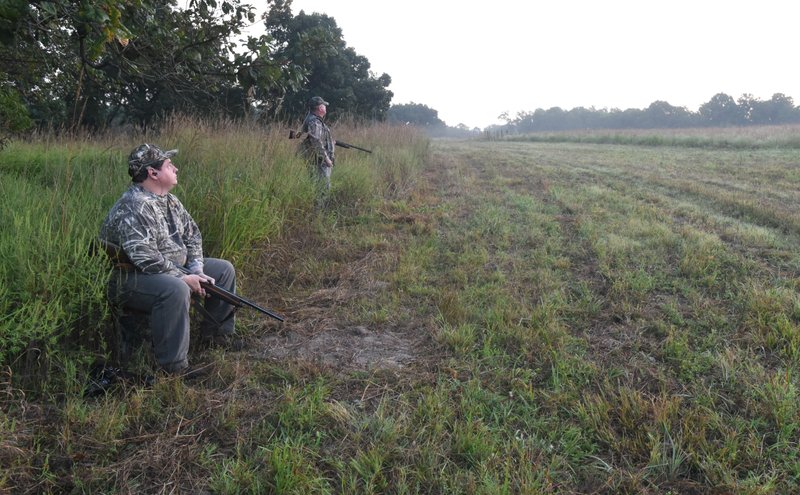 Bland (left) is an ardent hunter and angler. Here he hunts doves at Lake Wedington Wildlife Management Area in September with his friend, Gary Orr.