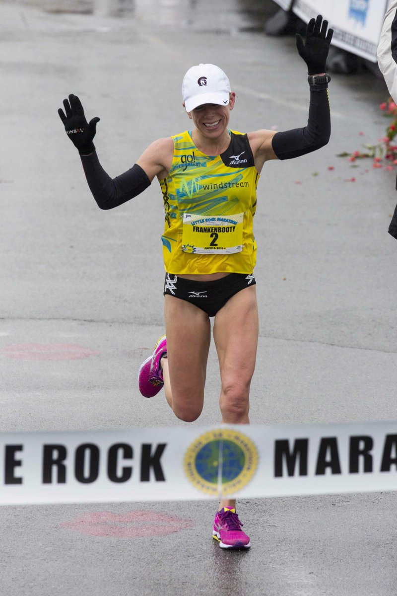 Leah Thorvilson crosses the finish line as the winner of the women's 2014 Little Rock Marathon March 2, 2014. The champion runner and Little Rock resident is also a stellar cyclist who recently appeared on the King of the Ride podcast with Ted King. (Photo by Melissa Sue Gerrits with the Democrat-Gazette)