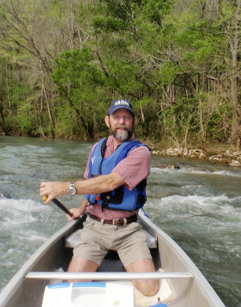 NWA Democrat-Gazette/FLIP PUTTHOFF 
Mike Mills of Ponca kneels in his canoe in this 2009 photo during a trip on the Buffalo National River. Kneeling makes a canoe more stable and minimizes tipping over.