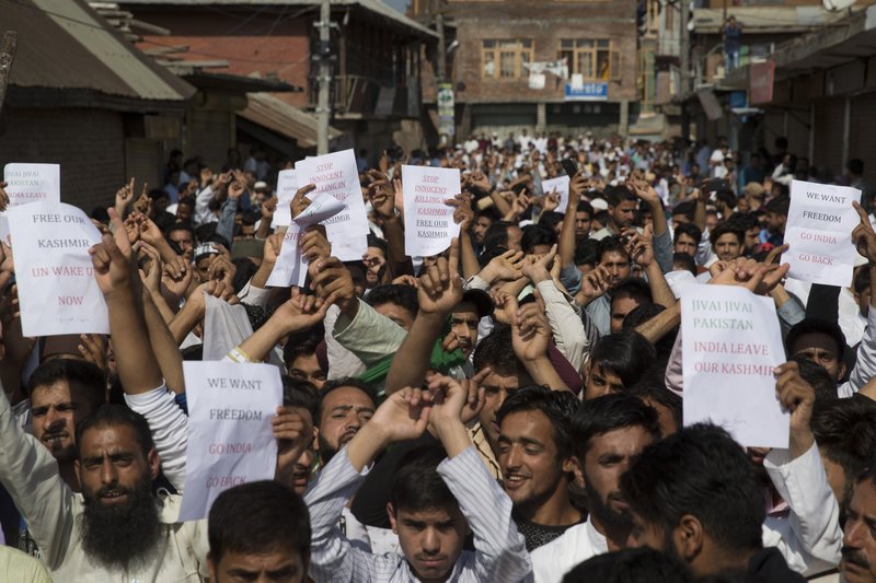 Kashmiri Muslims shout slogans during a protest after Eid prayers in Srinagar, Indian controlled Kashmir, Monday, Aug. 12, 2019. Troops in India-administered Kashmir allowed some Muslims to walk to local mosques alone or in pairs to pray for the Eid al-Adha festival on Monday during an unprecedented security lockdown that still forced most people in the disputed region to stay indoors on the Islamic holy day. (AP Photo/ Dar Yasin)