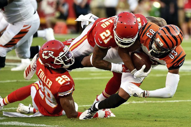 Kansas City cornerback Bashaud Breeland (21) tackles Cincinnati wide receiver Tyler Boyd during an exhibition game Saturday. Breeland was one of several defensive free agents the Chiefs signed in the offseason. 