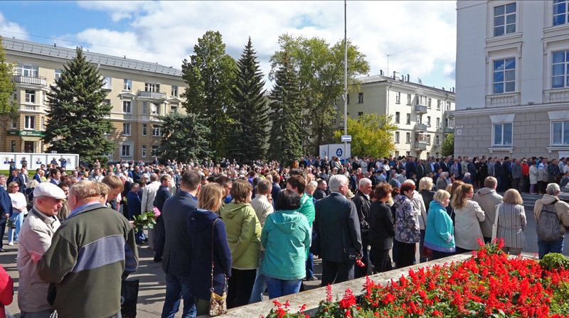 In this grab taken from a footage provided by the Russian State Atomic Energy Corporation ROSATOM press service, people gather for the funerals of five Russian nuclear engineers killed by a rocket explosion in Sarov, the closed city, located 370 kilometers (230 miles) east of Moscow, Monday, Aug. 12, 2019.  (Russian State Atomic Energy Corporation ROSATOM via AP)