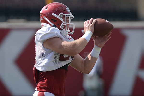 Arkansas linebacker Hayden Henry catches a ball Tuesday, Aug. 13, 2019, during practice at the university practice facility in Fayetteville.