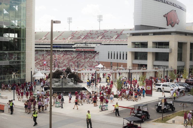 Attendees crowd the north endzone entrance during a tailgate before a Saturday, September 1, 2018 at Razorback Stadium in Fayetteville. 