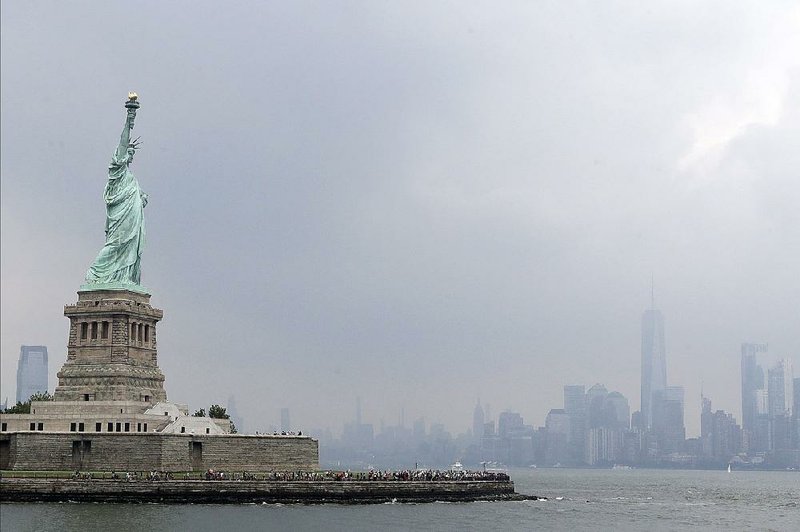 Stormy weather enshrouds the Statue of Liberty on Wednesday in New York Harbor. 