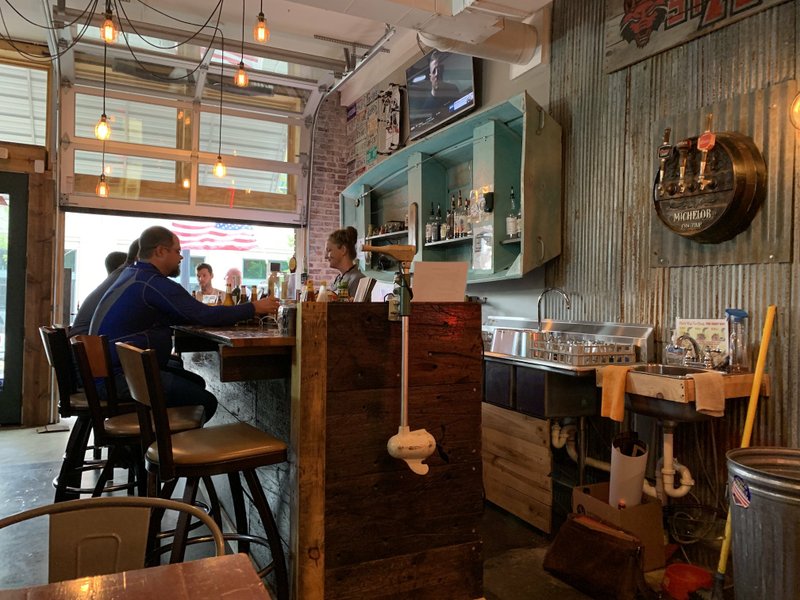 There's a boat on the wall, complete with fishing rod, behind the bar at Lucky Lou's, on the south (East Third Street) edge of Little Rock's River Market District. A trolling motor on the end of the bar keeps things moving. Arkansas Democrat-Gazette/Eric E. Harrison