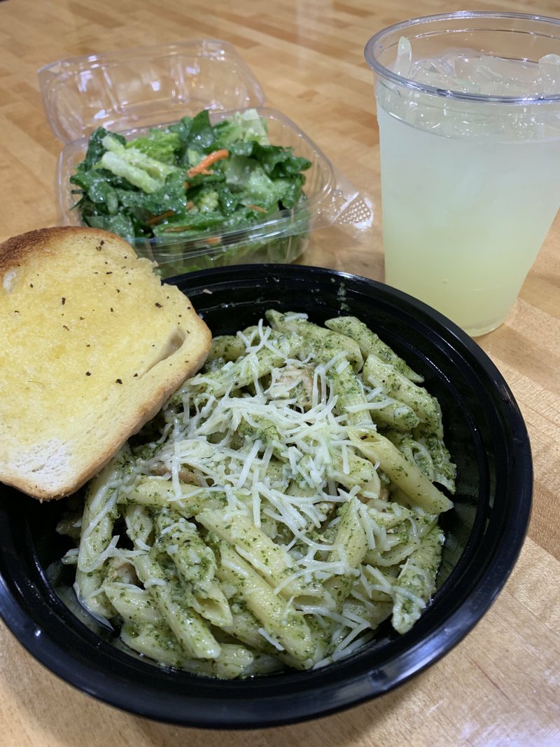Lunch specials -- including this Pesto Chicken with penne -- come with a side salad, a piece of garlic bread and a 12-ounce beverage (tea, water or lemonade) at Pasta J Italian in the River Market's Ottenheimer Market Hall. Arkansas Democrat-Gazette/Eric E. Harrison

