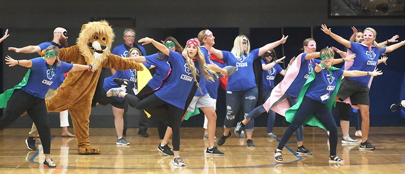 The Sentinel-Record/Richard Rasmussen FLASH MOB: Jessieville School District faculty members dance at a first day of school assembly Wednesday.