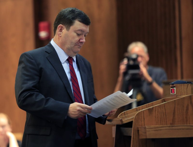  In this Tuesday, July 18, 2017 file photo, Kansas Solicitor General Stephen McAllister looks over his notes while making an argument before the Kansas Supreme Court in Topeka, Kan. Prosecutors in the U.S. attorney's office in Kansas City, Kan., improperly listened to recorded communications between inmates and their defense attorneys and willfully violated court orders during an independent investigation of the systemic practice, a judge said in a ruling on Tuesday, Aug. 13, 2019, that could upend hundreds of federal convictions and sentences.(AP Photo/Orlin Wagner, File)