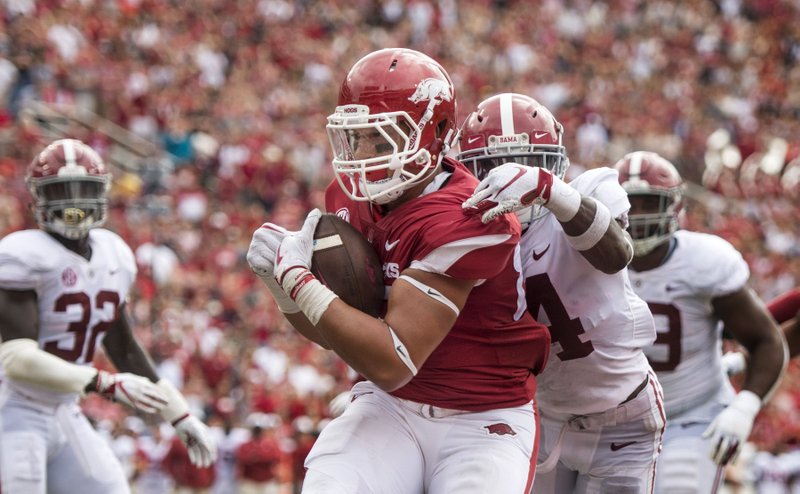 Tight end Cheyenne “C.J.” O’Grady (front) suffered a sprained knee in practice Tuesday and had surgery Wednesday. Coach Chad Morris said he expects O’Grady to be back “in about two weeks.” 