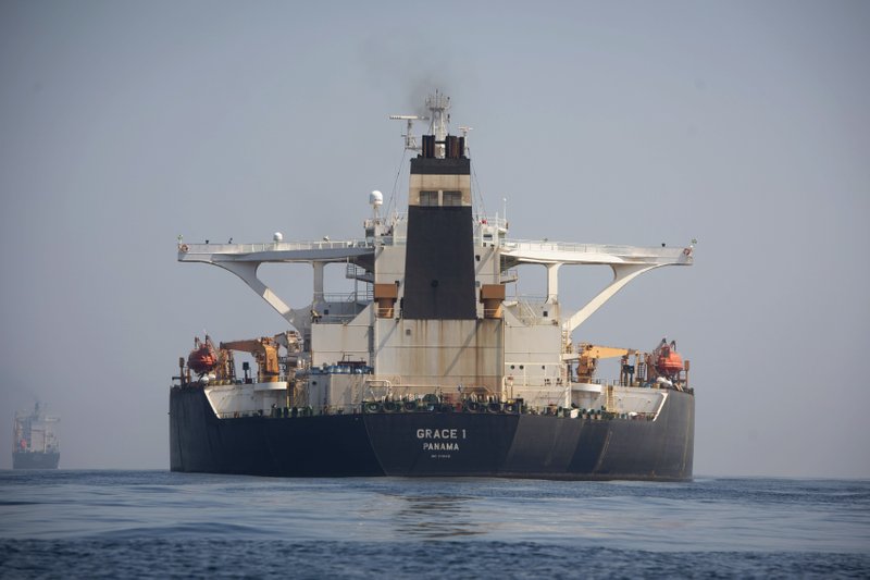 A stern view of the Grace 1 super tanker in the British territory of Gibraltar, Thursday, Aug. 15, 2019, seized last month in a British Royal Navy operation off Gibraltar. The United States moved on Thursday to halt the release of the Iranian supertanker Grace 1, detained in Gibraltar for breaching EU sanctions on oil shipments to Syria, thwarting efforts by authorities in London and the British overseas territory to defuse tensions with Tehran. (AP Photo/Marcos Moreno)

