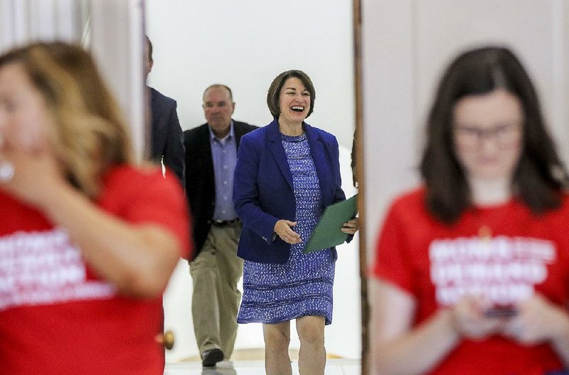 Democratic presidential candidate U.S. Sen. Amy Klobuchar of Minnesota arrives Thursday at the state Capitol for a news conference on gun violence. 