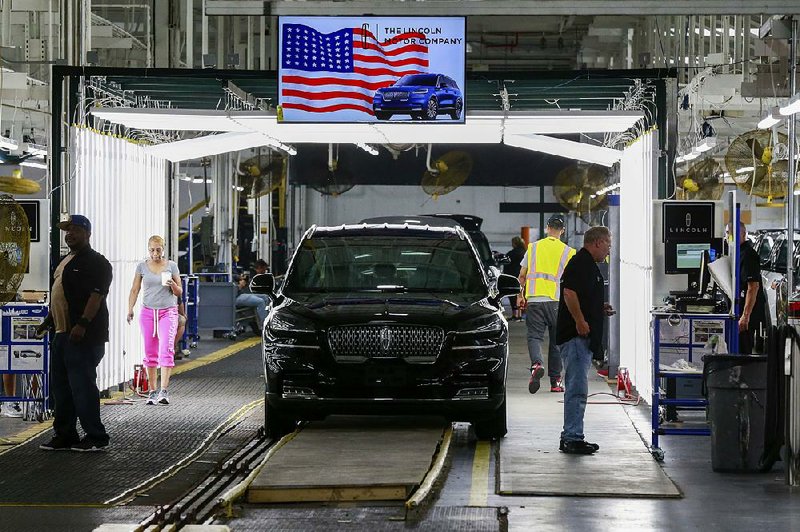 Dips in U.S. factory production included the automobile sector, like this Lincoln Aviator being assembled at a Ford plant in Chicago. 