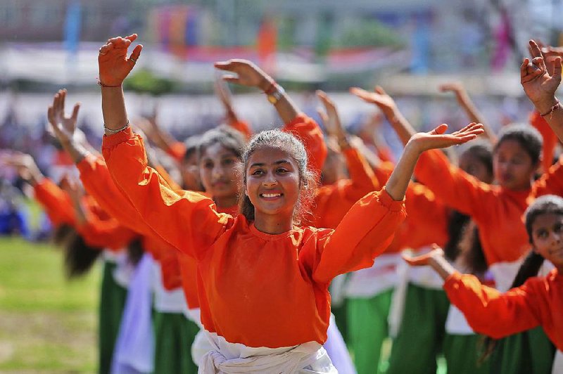 Students dance during Independence Day celebrations Thursday in Jammu, India. India gained its independence from British colonial rule on Aug. 15, 1947.