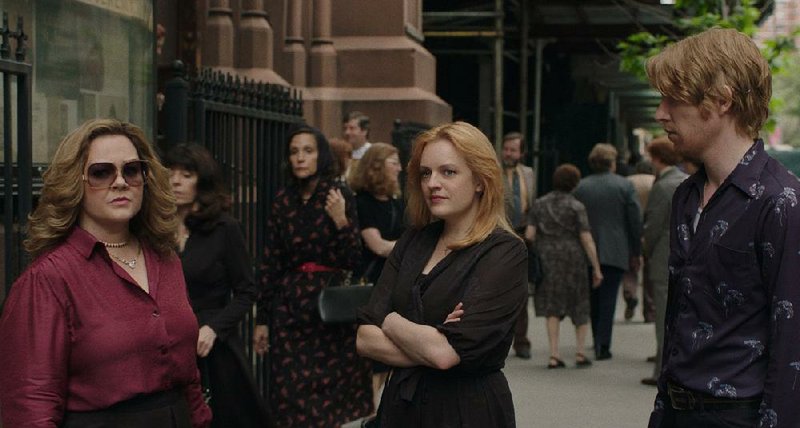 Melissa McCarthy (left), Elisabeth Moss and Domhnall Gleeson star in New Line Cinema’s mob drama The Kitchen. The film opened with a dismal $5.5 million and came in seventh place at last weekend’s box office. 