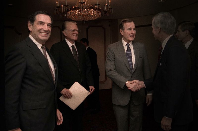 The seemingly omnipresent Doug Coe (left) meets with Billy Graham and President George H.W. Bush sometime in the ’80s. 