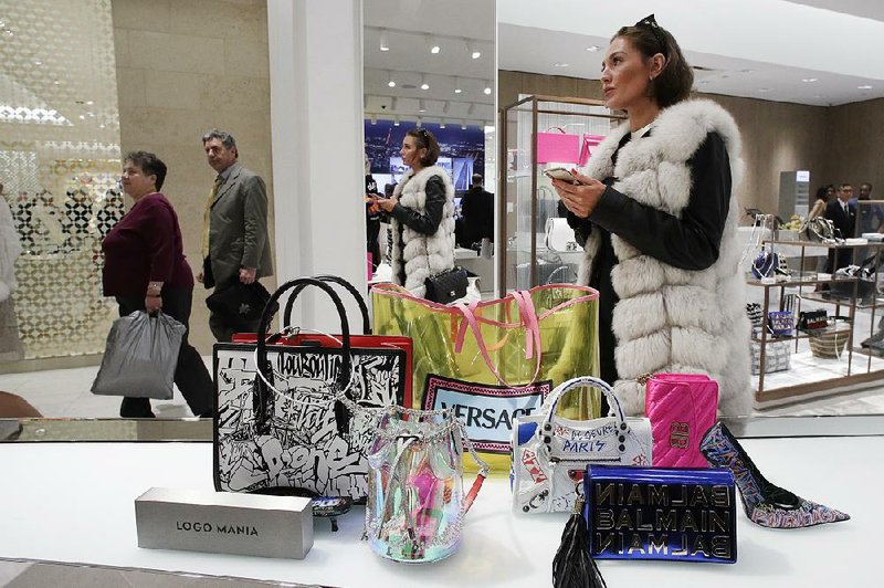 A woman shops at Neiman Marcus during the opening night of The Shops & Restaurants at Hudson Yards in New York in March. 
