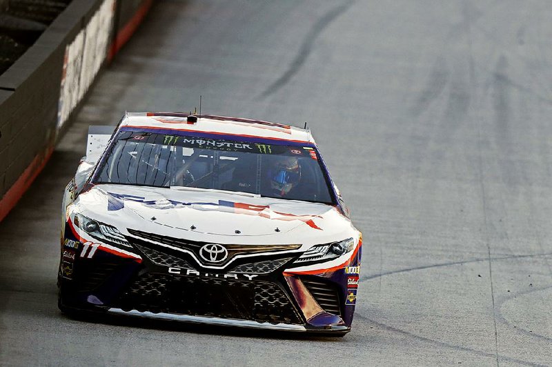 Denny Hamlin makes his way around the track during Friday’s qualifying for today’s NASCAR Cup Series race in Bristol, Tenn. Hamlin will start on the pole. 