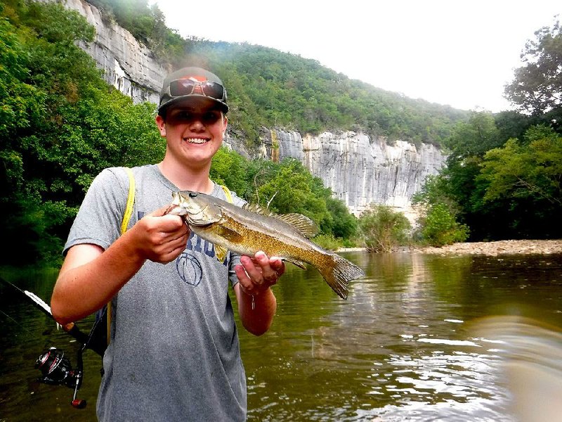 J.T. Staggs of Little Rock admires his last fish of the day on the Buffalo River, a 16-inch beauty that struck downstream from the campground at Steel Creek.