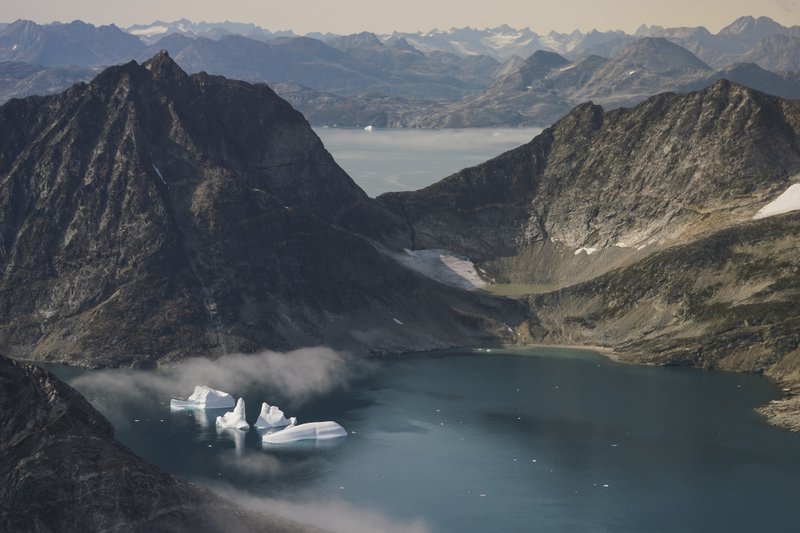 The Associated Press GREENLAND'S ICEBERGS: Icebergs are photographed Wednesday from the window of an airplane carrying NASA Scientists as they fly on a mission to track melting ice in eastern Greenland. Greenland has been melting faster in the last decade and this summer, it has seen two of the biggest melts on record since 2012.