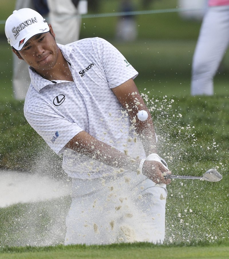 The Associated Press NO BEACH TROUBLES: Hideki Matsuyama, of Japan, hits out of the bunker on the ninth hole Friday during the BMW Championship in Medinah, Ill.