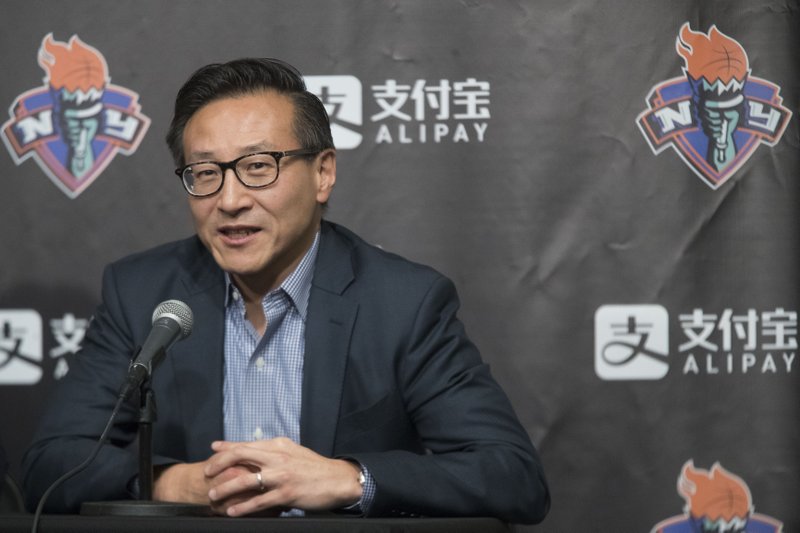 FILE - In this May 9, 2019, file photo, Joe Tsai speaks to reporters during a news conference before a WNBA exhibition basketball game between the New York Liberty and China in New York. Tsai has agreed to buy the remaining 51 percent of the Brooklyn Nets and Barclays Center from Mikhail Prokhorov in deals that two people with knowledge of the details say are worth about $3.4 billion. Terms were not disclosed Friday, Aug. 16, 2019, but the people told The Associated Press that Tsai is paying about $2.35 for the Nets &#x2014; a record for a U.S. pro sports franchise &#x2014; and nearly $1 billion in a separate transaction for the arena. (AP Photo/Mary Altaffer, File)