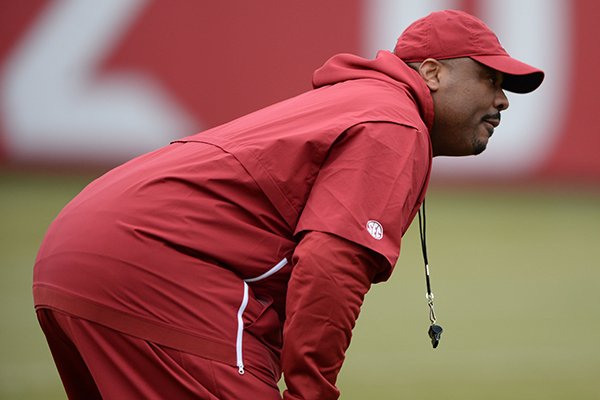Arkansas assistant coach Kenny Ingram watches Friday, March 1, 2019, during practice at the university practice facility in Fayetteville.