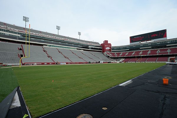 Work continues Wednesday, Aug. 7, 2019, to install a turf playing surface at Razorback Stadium in Fayetteville.