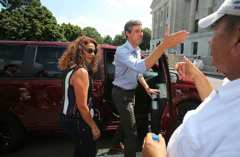 Democratic presidential candidate Beto O’Rourke  (center) meets with  supporters Saturday after speaking during the Moms Demand Action rally at the state Capitol in Little Rock. 